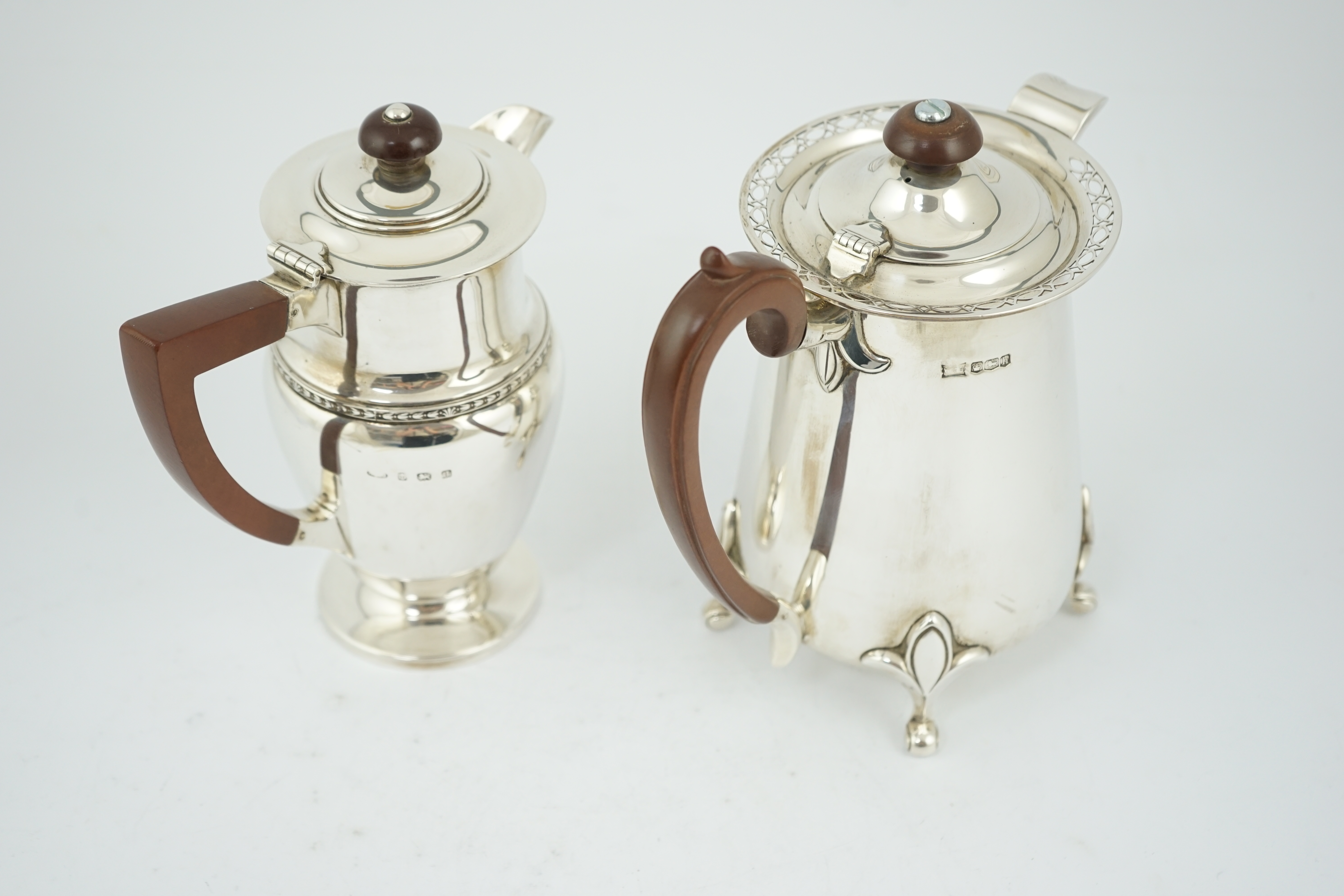 A George V silver hot water pot by Walker & Hall, Sheffield, 1925, and one other silver hot water pot by Albert Edward Jones, Birmingham, Birmingham, 1933